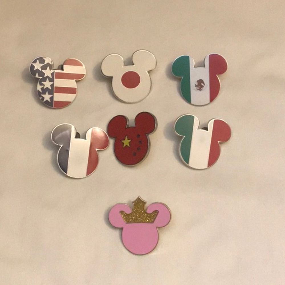 Sold. Disney pin 7 piece Mickey head set